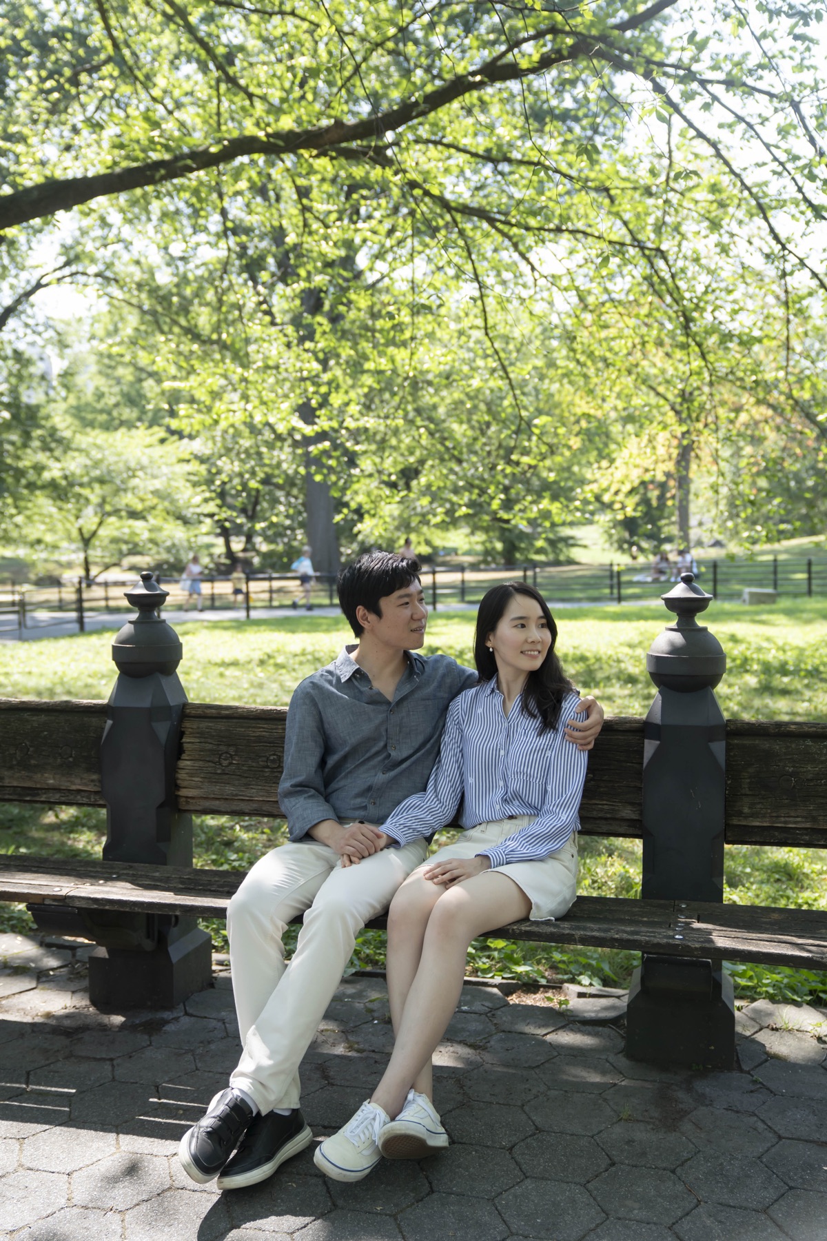 SeungUk and Jiwon sitting together on a park bench